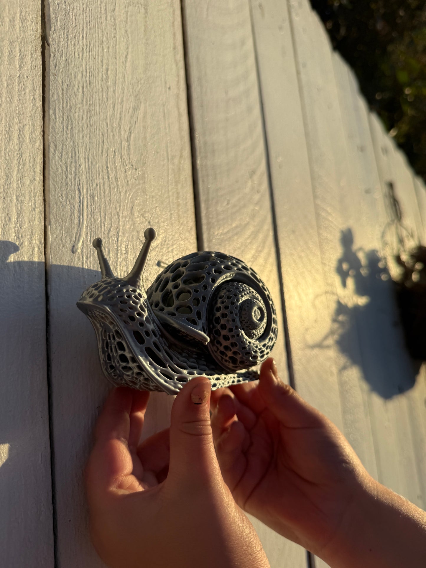 Silver 3D printed snail made by Nora